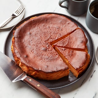 A Sweet Potato Basque Cheesecake being sliced.
